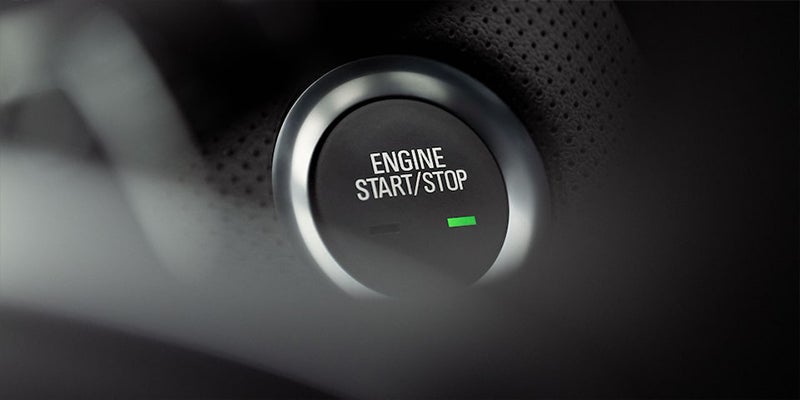 Close-up shot of Cadillac CT4 engine start-stop button.