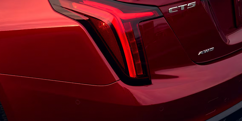 Close-up of red Cadillac CT5 rear vertical LED taillight.