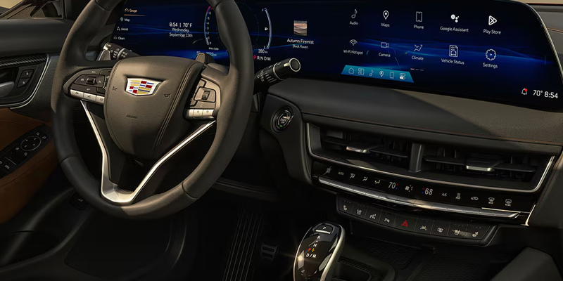 Wide curved dashboard display screen inside a Cadillac CT5.